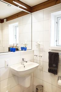 Ванная комната в Blockhaus Ferien - Ferienhaus Hakon