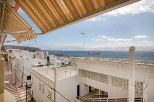 a view of the ocean from the balcony of a building at Ceyla in Arona