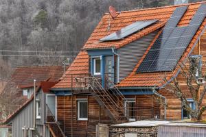 a house with solar panels on the roof at Sommers Idylle in Sulzau