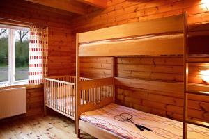 Postel nebo postele na pokoji v ubytování Blockhaus Ferien - Ferienwohnung Askjell