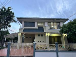a house with a fence in front of it at Spacious and peaceful 3 bedrooms detached house inside Bangkok in Ban Klong Plad Kriang