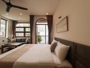 Ένα ή περισσότερα κρεβάτια σε δωμάτιο στο Picnic Day Danang