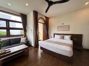 Ένα ή περισσότερα κρεβάτια σε δωμάτιο στο Picnic Day Danang +7 φωτογραφίες