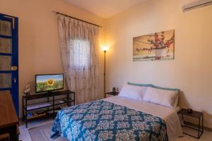 Giường trong phòng chung tại Aspa's House