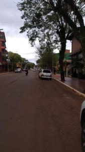 a white car parked on the side of a street at San Martin Apart in Puerto Rico