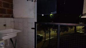 a bathroom with a toilet and a sink at San Martin Apart in Puerto Rico
