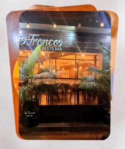 a reflection of a restaurant in a window at San Martin Apart in Puerto Rico