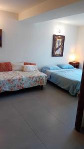 Katil atau katil-katil dalam bilik di Bel appartement Spacieux