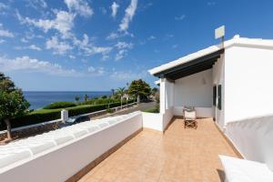 a balcony with a view of the ocean at Villa Esther vistas al mar Menorca in Cap d'en Font