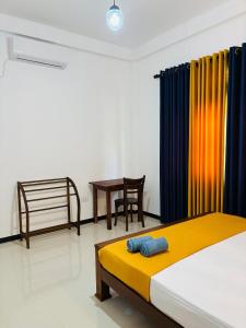 Postel nebo postele na pokoji v ubytování Eagle Wings Mirissa + 9 fotografií