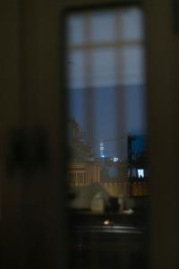 a view of a city from a window at Beijing Xiaofengxian Former Residence Hotel Tiananmen Square Qianmen Store in Beijing