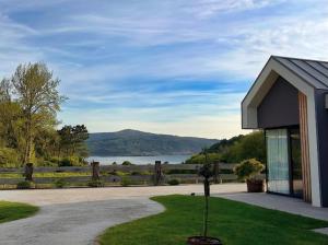 a house with a view of a lake and mountains at Balarés Hotel da Natureza in Ponteceso