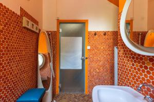 a bathroom with a shower and a sink and a mirror at La Closerie du Cassereau in Vernou-sur-Brenne +25 photos