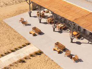 an overhead view of a patio with tables and chairs at Ayla Corfu in Kavos +23 photos