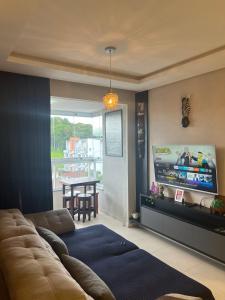 Μια τηλεόραση ή/και κέντρο ψυχαγωγίας στο Bom retiro · 6 km Aeroporto/ 1 km do Shopping Garten/2km Square