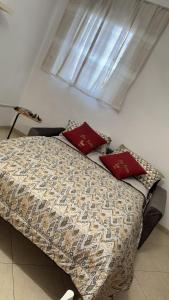 En eller flere senge i et værelse på Casa vacanze Nunù