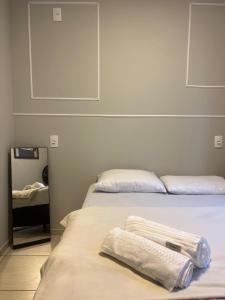 Ένα ή περισσότερα κρεβάτια σε δωμάτιο στο IR 02 · Próximo ao hospital Hans Dieter / Térreo