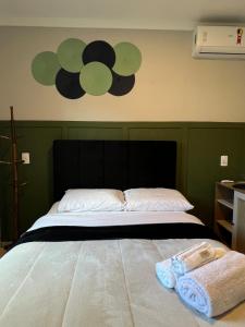 Ένα ή περισσότερα κρεβάτια σε δωμάτιο στο IR 02 · Próximo ao hospital Hans Dieter / Térreo