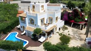 an aerial view of a house with a swimming pool at Villa Alba in Santa Eularia des Riu