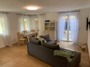 a living room with a couch and a table at Bee Home in Schuttertal
