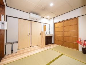 a room with sliding doors and a sink at kyomachiya-京町家Oneworld十条-Jujo in Kyoto +159 photos
