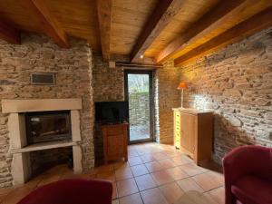 TV a/nebo společenská místnost v ubytování Les Buis