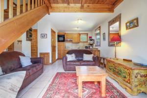 a living room with two couches and a table at Amethyste - 2 Bedrooms & Free Parking - By Cozee Rentals in Les Houches