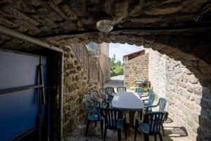 an alley with a table and chairs in a building at Hamlet in Lablachère