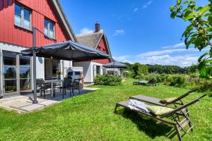 Κήπος έξω από το Ferienhaus Küstenhuus 20 Feriendorf Klein Stresow Rügen by ruyastay