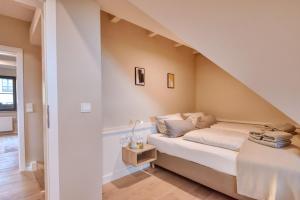 Ένα ή περισσότερα κρεβάτια σε δωμάτιο στο Ferienhaus Küstenhuus 20 Feriendorf Klein Stresow Rügen by ruyastay