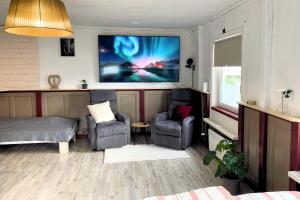 Χώρος καθιστικού στο Gemütliche Ferienwohnung in Nordschweden