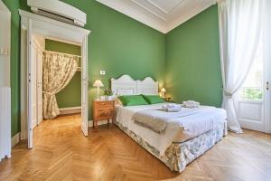 Ένα ή περισσότερα κρεβάτια σε δωμάτιο στο B&b La Foresteria