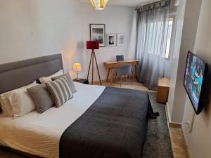 Voodi või voodid majutusasutuse Grand appartement de luxe vue mer toas
