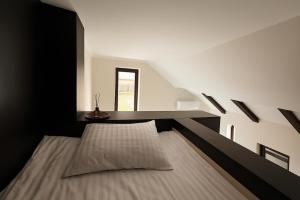 a black and white bedroom with a bed and a window at Irbis hotel in Mestia