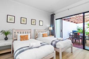 Ένα ή περισσότερα κρεβάτια σε δωμάτιο στο 19 Ascension by Host Agents