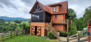 a house on the side of a hill at Mio Nido at Eagles Nest in Newland +17 photos