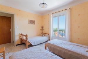 Postel nebo postele na pokoji v ubytování Les Albères