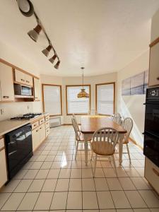 a kitchen with a table and chairs in a room at Cozy 2BR Basement Apartment with Private Entry & Parking in Elizabeth, NJ in Elizabeth +16 photos