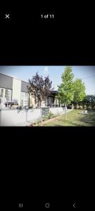 a picture of a building with trees in front of it at Villa Ola in Gjilan
