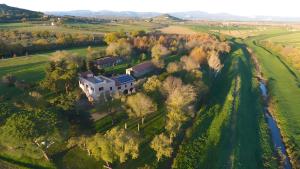an aerial view of a house in a field at Agriturismo La Concia in Gavorrano +59 photos