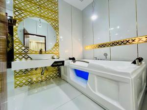 a bathroom with a sink and a mirror at Best Eastern Hotel Multan in Multan