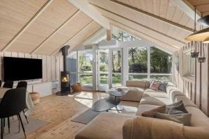 a living room with a couch and a tv at M397-Vaeggerlose-Stolt-Henriksvej-111 in Marielyst