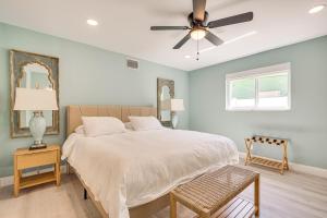 a bedroom with a bed and a ceiling fan at Spacious Yard, Near Golf Modern Home in Hollywood in Hollywood Beach