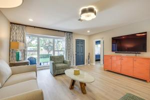 a living room with a couch and a tv at Spacious Yard, Near Golf Modern Home in Hollywood in Hollywood Beach