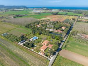 an aerial view of a house in a field at Il Girasole - Limone in Venturina Terme