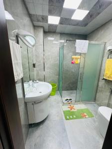 a bathroom with a shower and a sink and a toilet at Quba Village Villa in Quba +25 photos