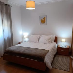 Postel nebo postele na pokoji v ubytování Casa da Gardunha