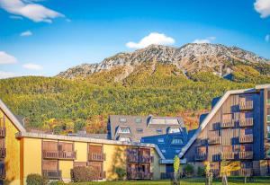 a resort with a mountain in the background at Cosy Et Lumineux À Montclar Alpes in Montclar