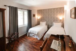 Ένα ή περισσότερα κρεβάτια σε δωμάτιο στο La Rabida Hotel Boutique