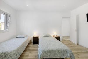 Ένα ή περισσότερα κρεβάτια σε δωμάτιο στο Piccola House